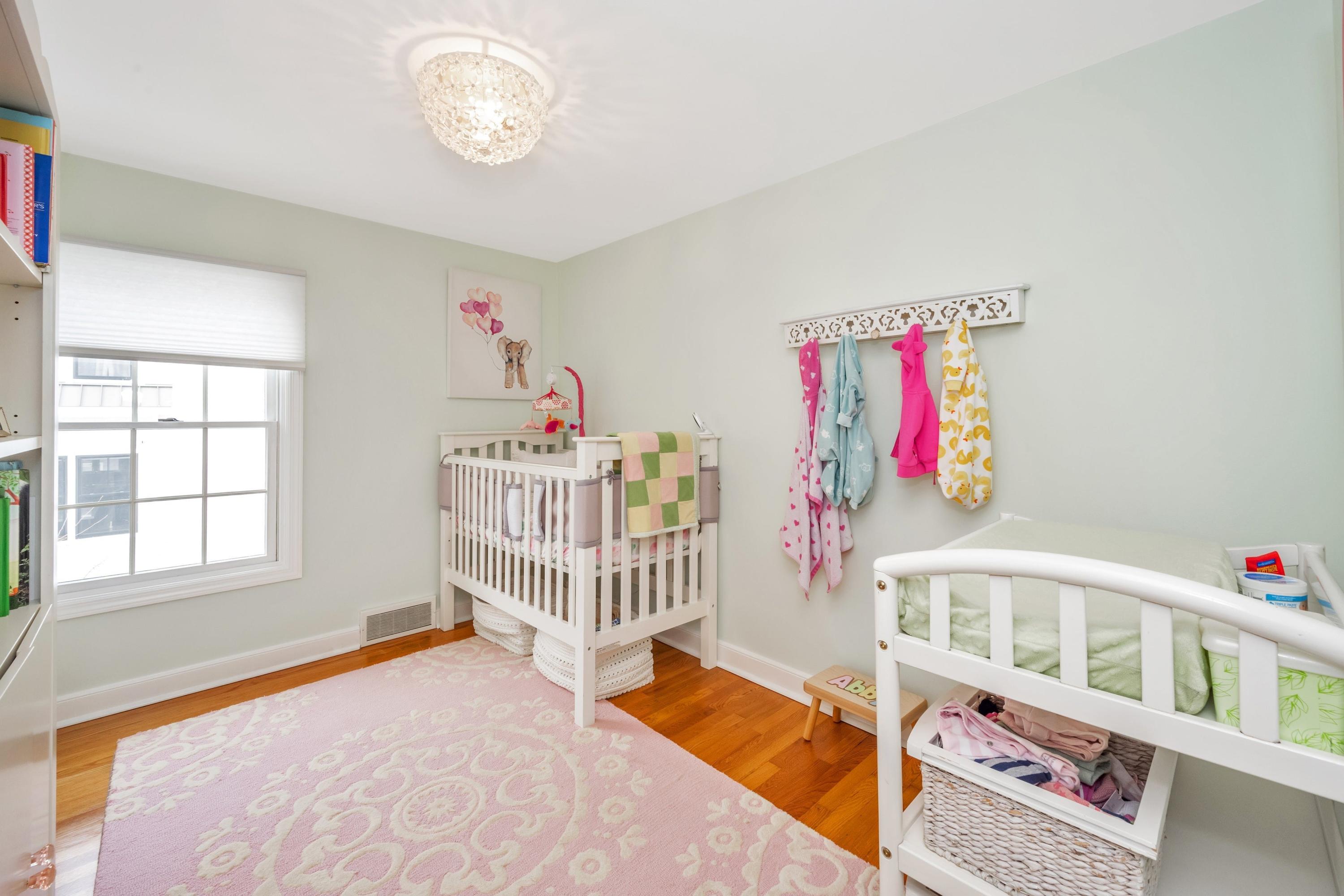 879 Oldfield Road Fairfield, CT 06824 - Photo 14 of 26 a bedroom with furniture and a window