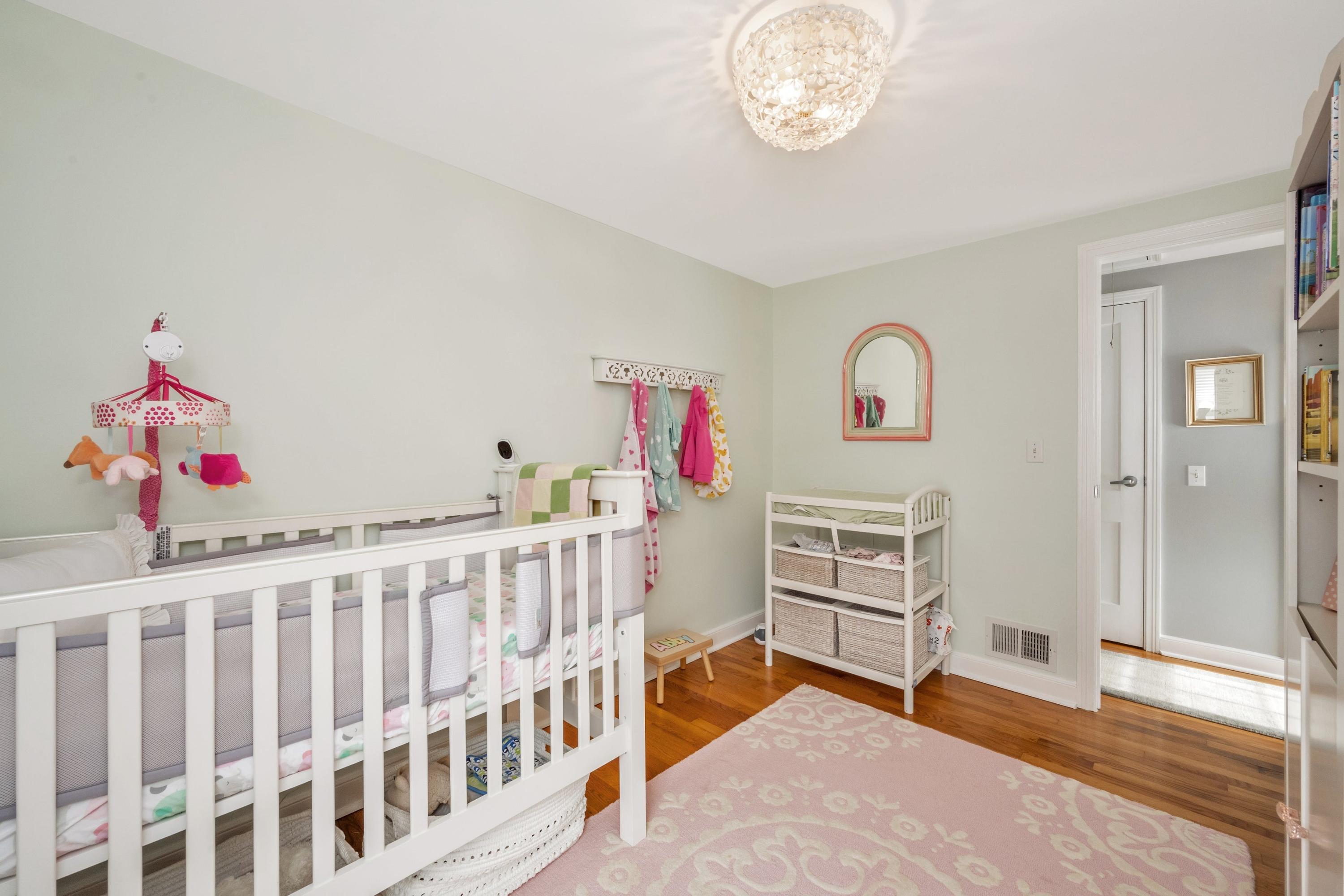 879 Oldfield Road Fairfield, CT 06824 - Photo 15 of 26 a bedroom with furniture and wooden floor