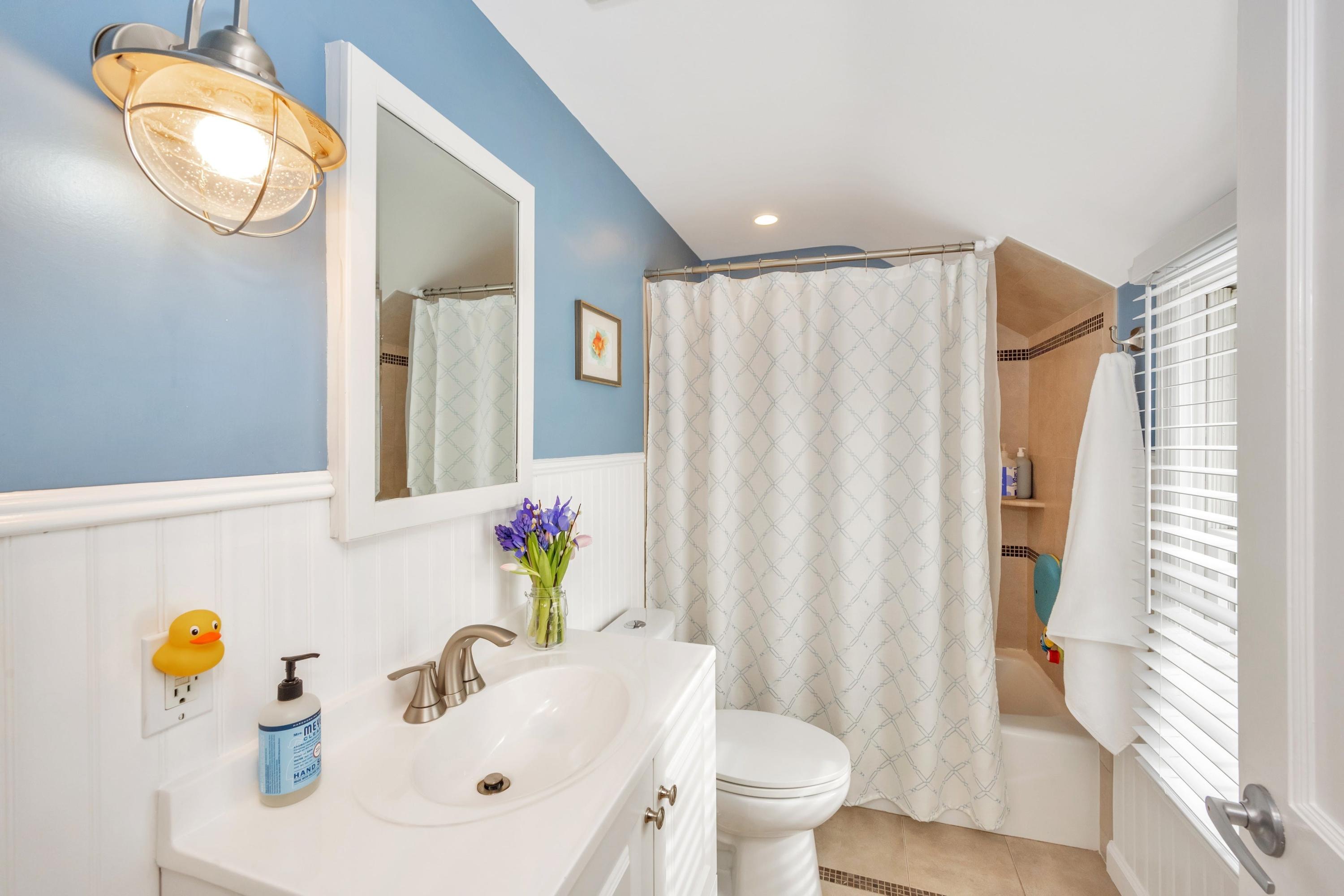879 Oldfield Road Fairfield, CT 06824 - Photo 16 of 26 a bathroom with a sink toilet and shower