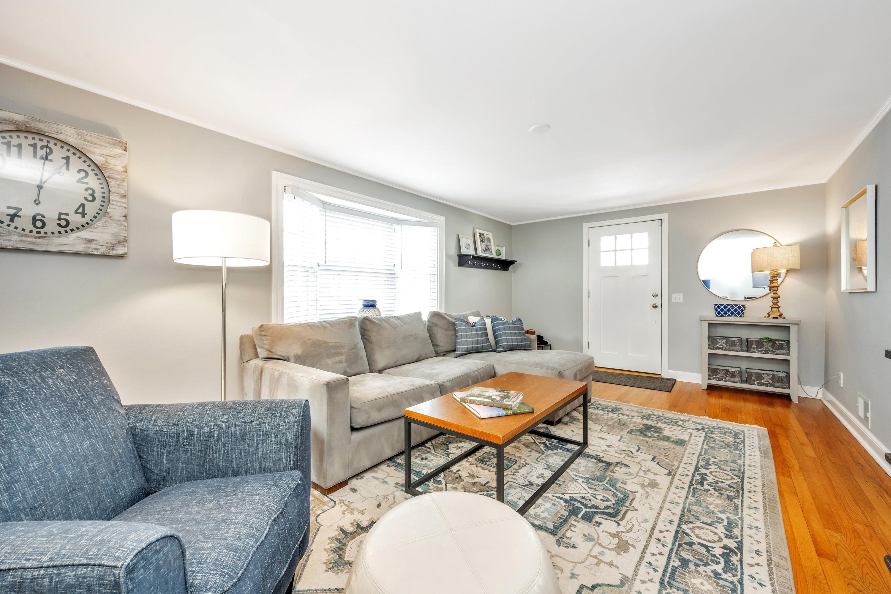 879 Oldfield Road Fairfield, CT 06824 - Photo 3 of 26 a living room with furniture and a table
