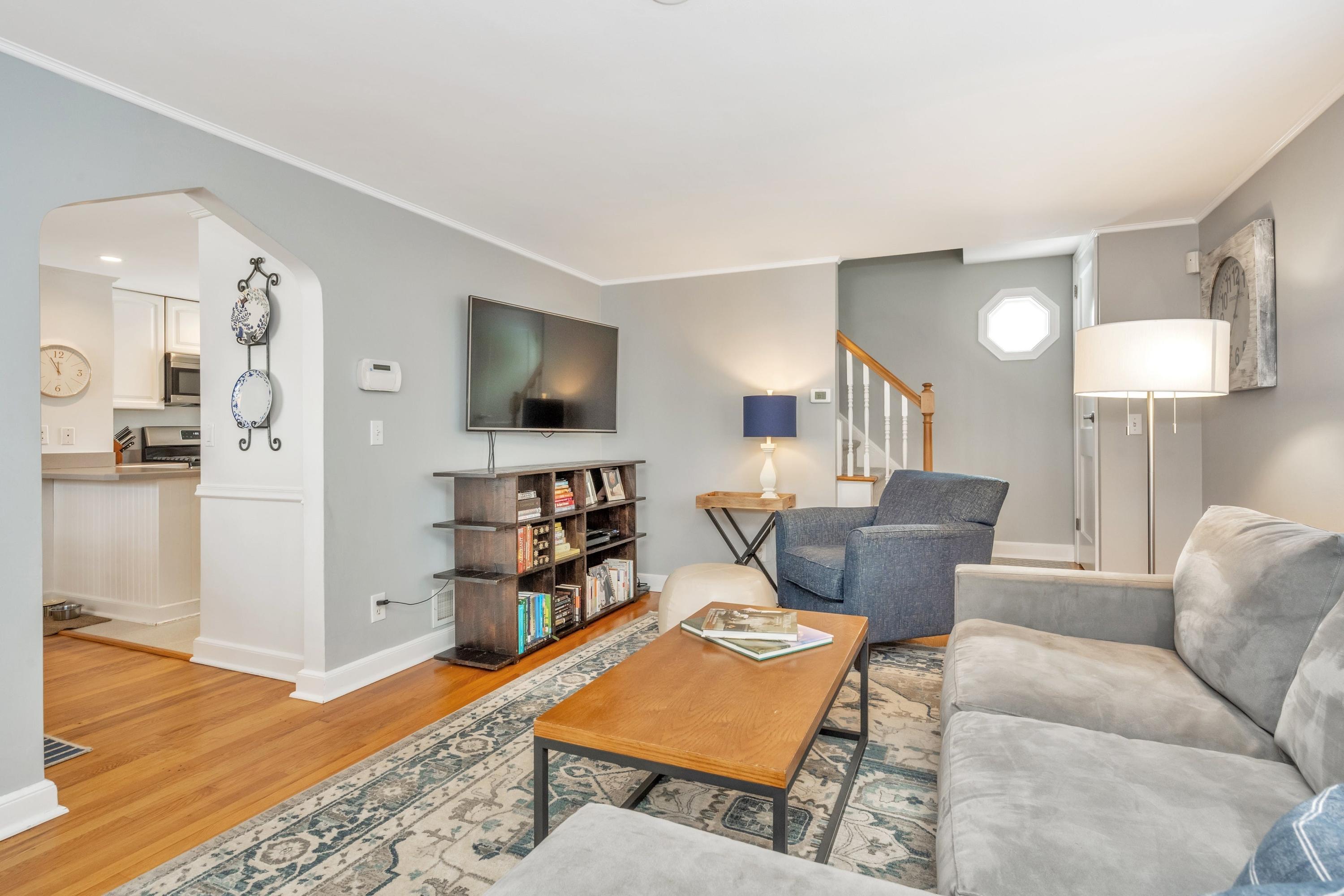 879 Oldfield Road Fairfield, CT 06824 - Photo 5 of 26 a living room with furniture and a wooden floor
