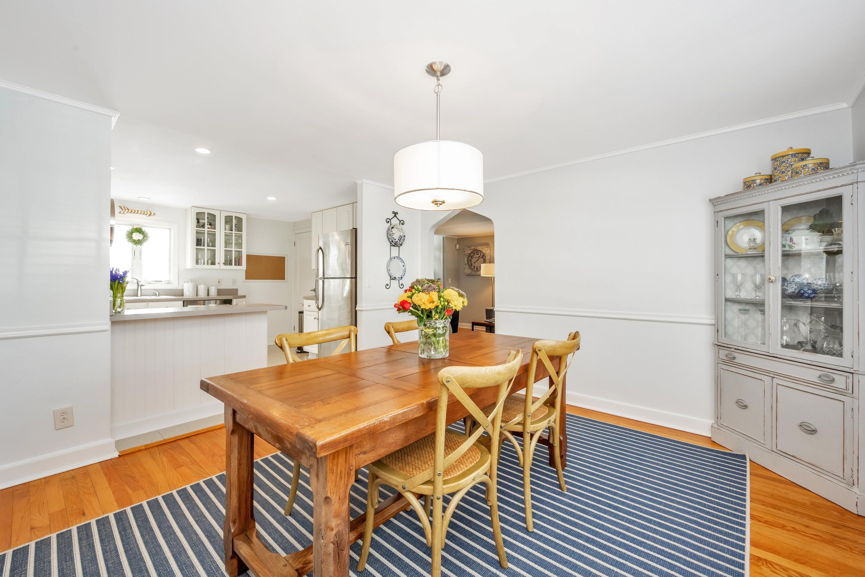 879 Oldfield Road Fairfield, CT 06824 - Photo 7 of 26 a view of a dining room with furniture and wooden floor