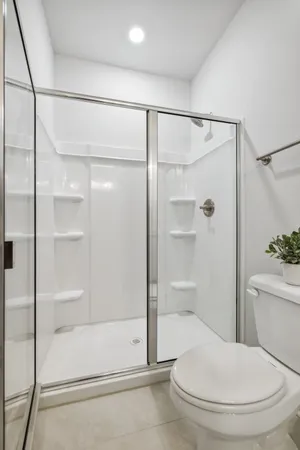 a living room with furniture a window and a table