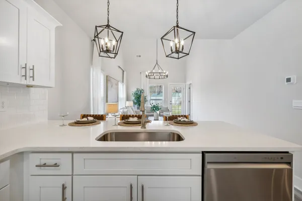 a bathroom with a sink a mirror and a window