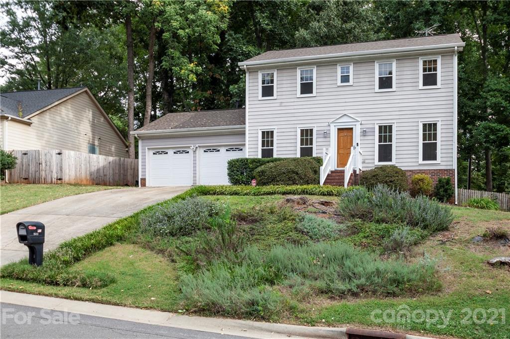 2512 Olde Whitehall Road Charlotte, NC 28273 - Photo 1 of 25 a front view of a house with a yard