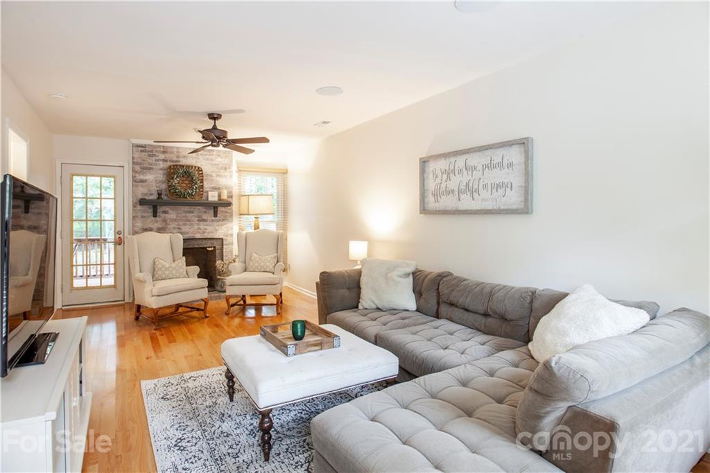 2512 Olde Whitehall Road Charlotte, NC 28273 - Photo 2 of 25 a living room with furniture wooden floor and a flat screen tv