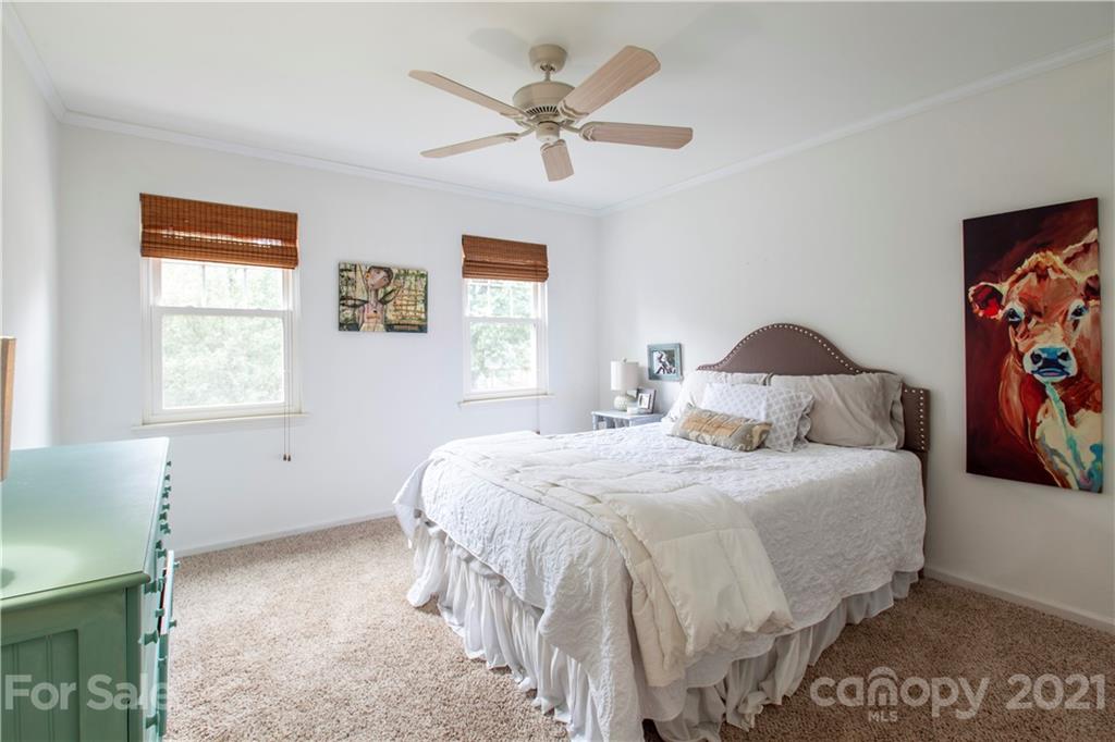2512 Olde Whitehall Road Charlotte, NC 28273 - Photo 13 of 25 a bedroom with a bed and a window with the potted plant