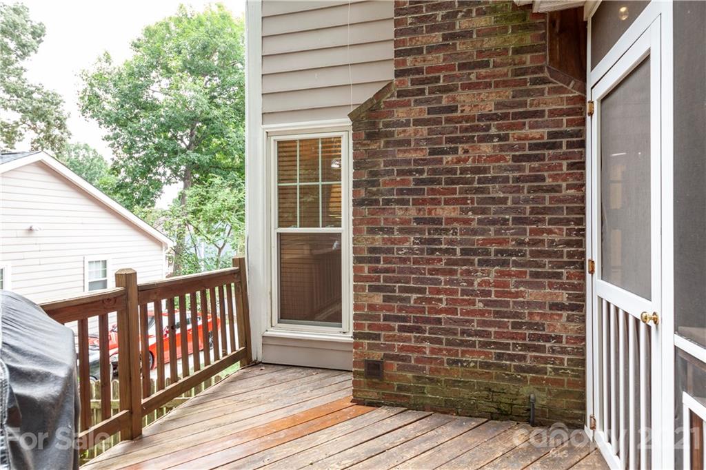 2512 Olde Whitehall Road Charlotte, NC 28273 - Photo 19 of 25 a view of a brick house with wooden fence