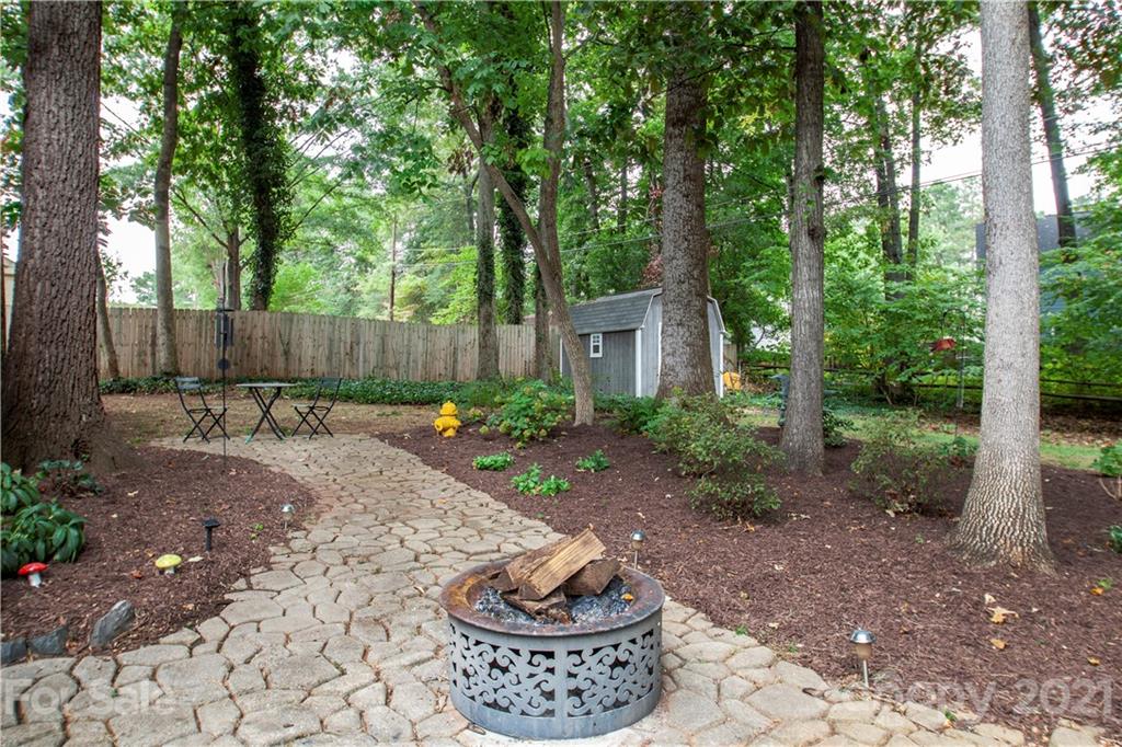 2512 Olde Whitehall Road Charlotte, NC 28273 - Photo 20 of 25 a view of a backyard with plants and trees