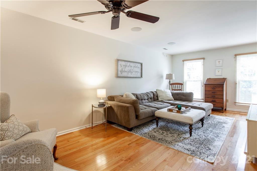 2512 Olde Whitehall Road Charlotte, NC 28273 - Photo 3 of 25 a living room with furniture and a rug