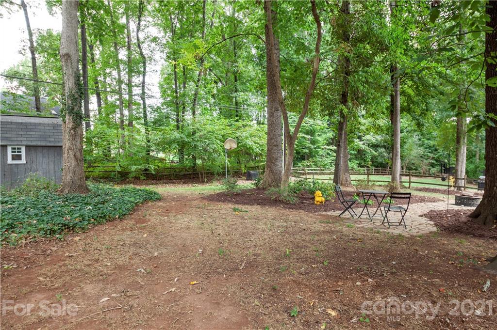 2512 Olde Whitehall Road Charlotte, NC 28273 - Photo 21 of 25 a view of a park with large trees and a bench
