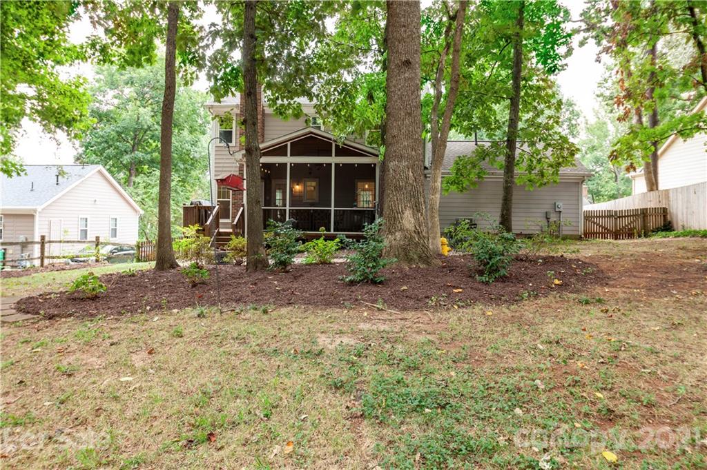 2512 Olde Whitehall Road Charlotte, NC 28273 - Photo 23 of 25 a view of a house with backyard and trees
