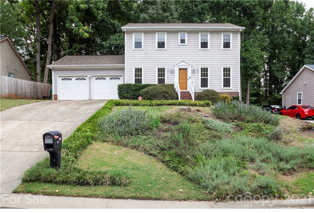 2512 Olde Whitehall Road Charlotte, NC 28273 - Photo 25 of 25 a front view of a house with garden
