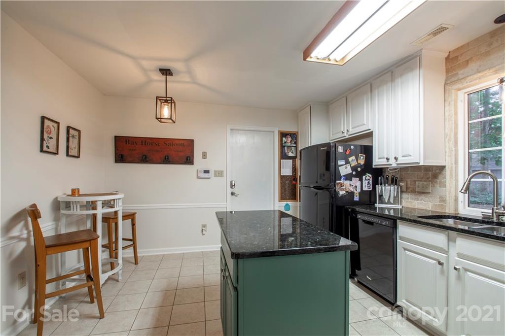 2512 Olde Whitehall Road Charlotte, NC 28273 - Photo 6 of 25 a kitchen with a cabinets and refrigerator