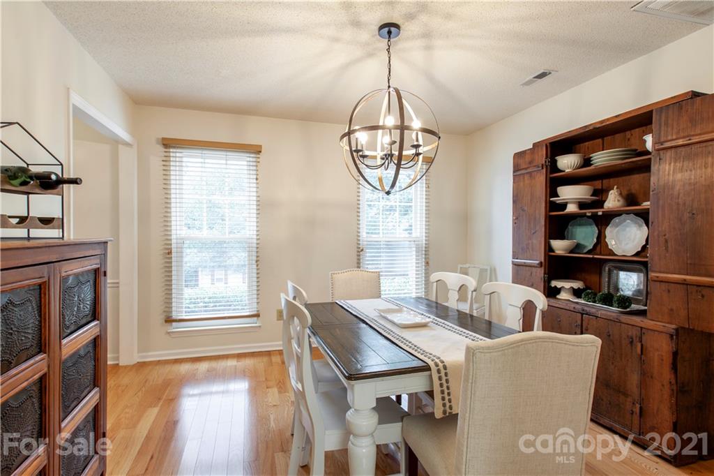 2512 Olde Whitehall Road Charlotte, NC 28273 - Photo 10 of 25 a living room with furniture a window and a chandelier