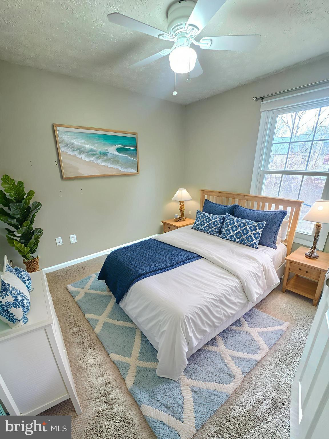 2108 Commodore Court Odenton, MD 21113 - Photo 16 of 38 a bedroom with a bed and a potted plant