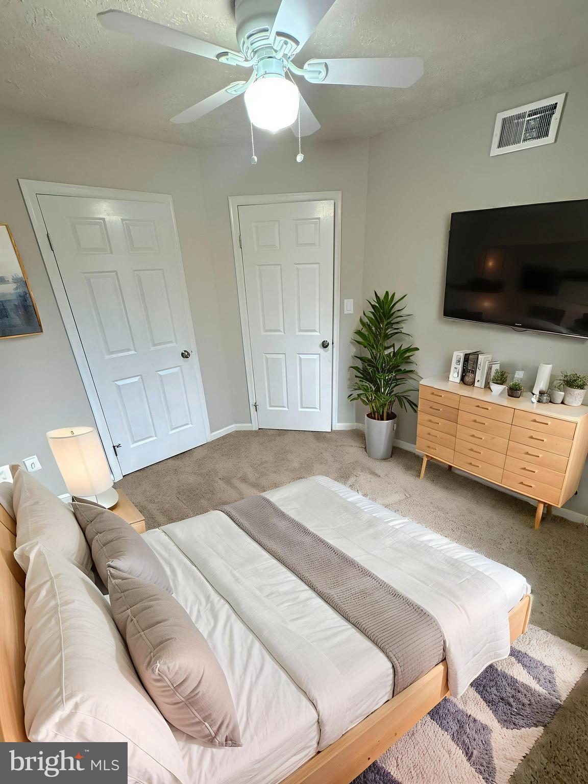 2108 Commodore Court Odenton, MD 21113 - Photo 18 of 38 a bedroom with a bed and a flat screen tv