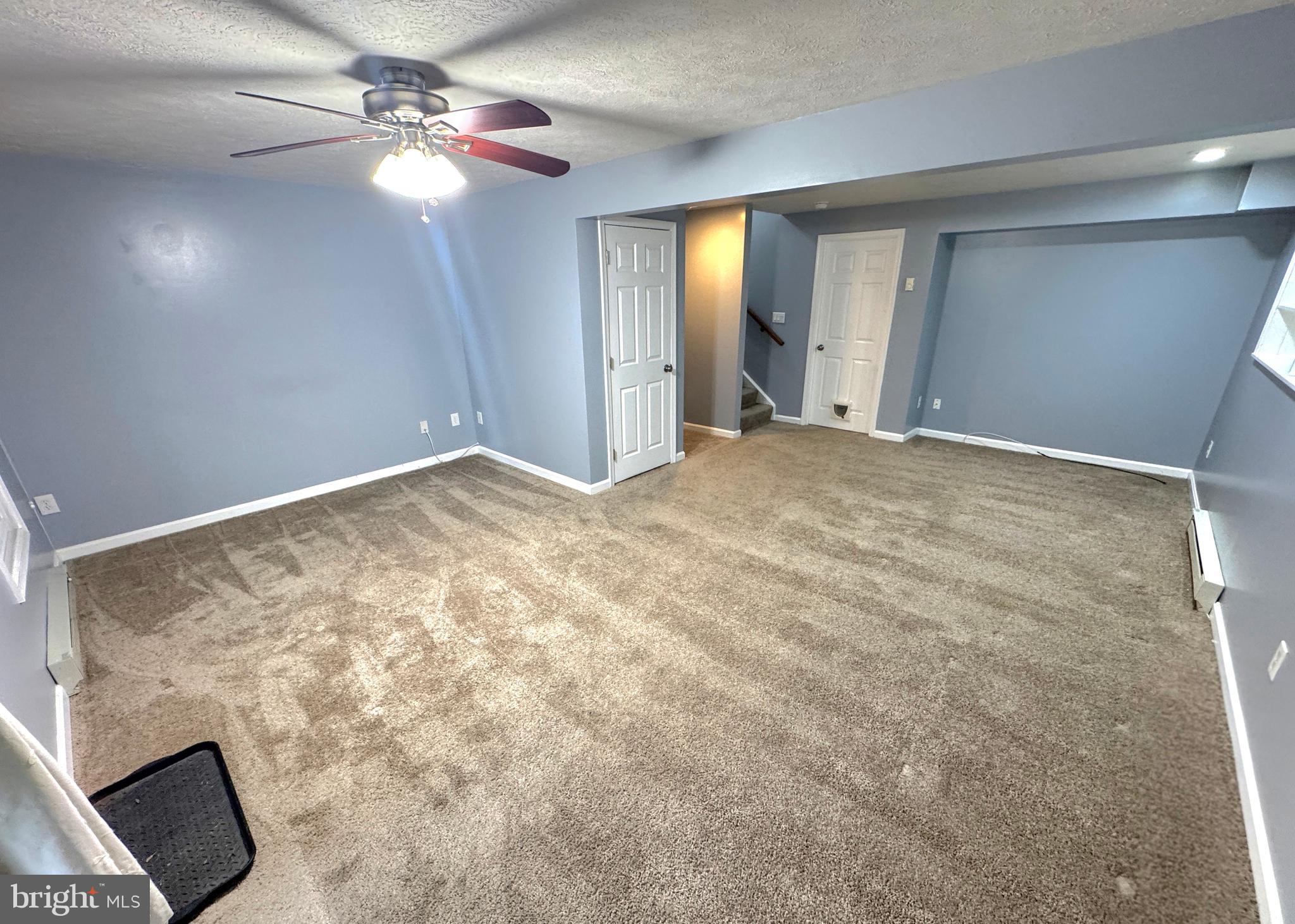 2108 Commodore Court Odenton, MD 21113 - Photo 29 of 38 a view of an empty room with a ceiling fan and a window