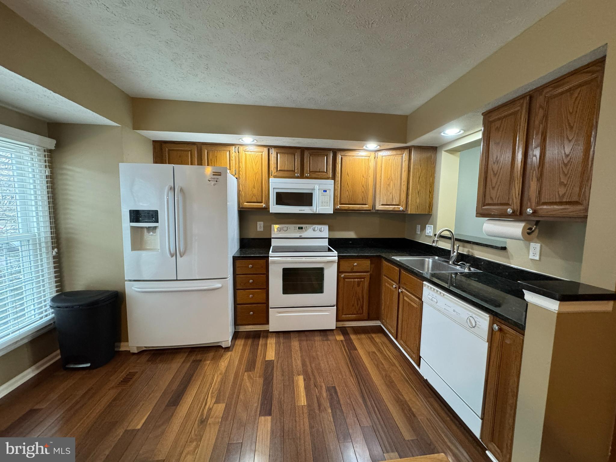 2108 Commodore Court Odenton, MD 21113 - Photo 4 of 38 a kitchen with wooden floors and appliances