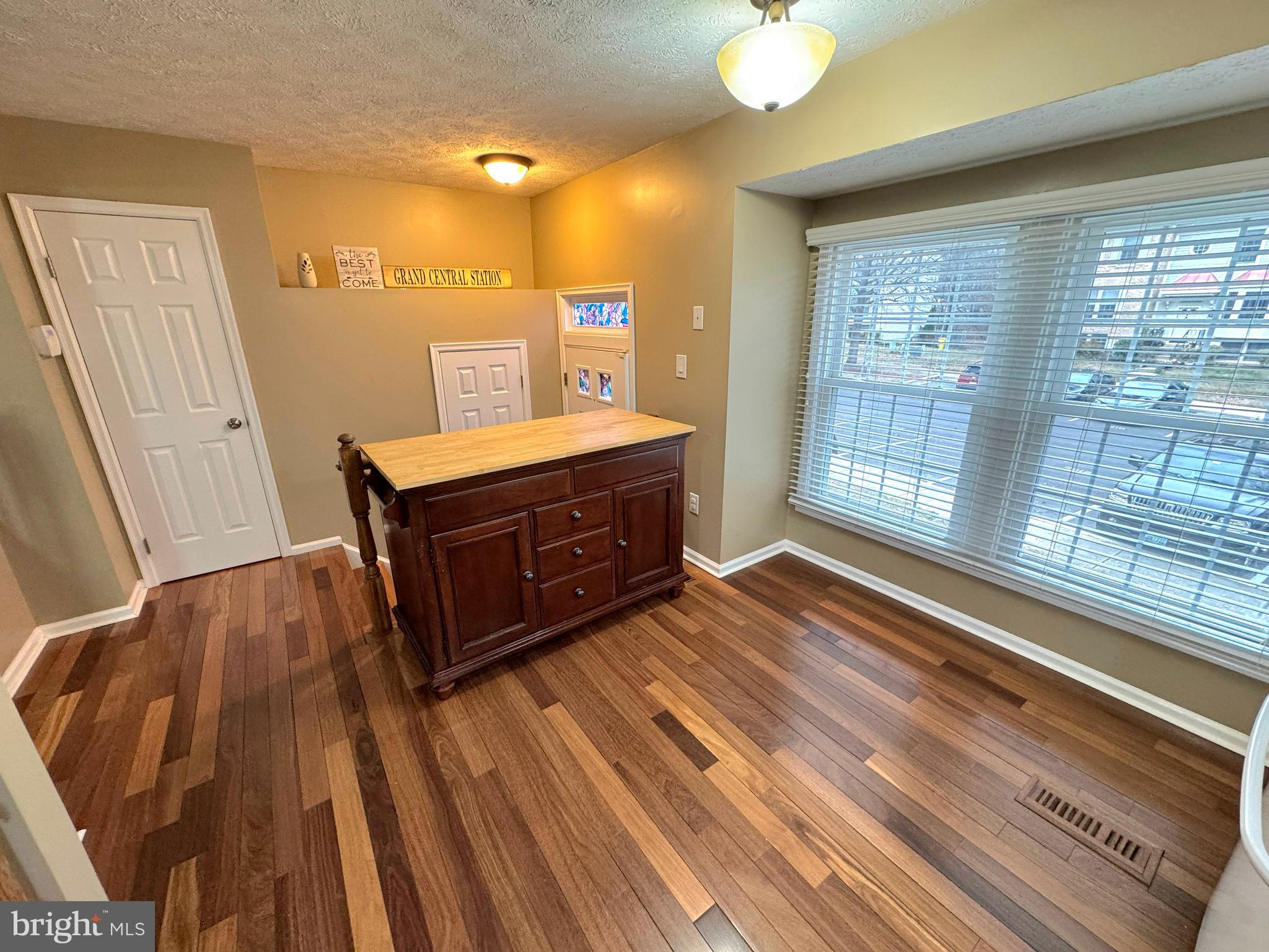 2108 Commodore Court Odenton, MD 21113 - Photo 6 of 38 a view of a room with wooden floor and windows
