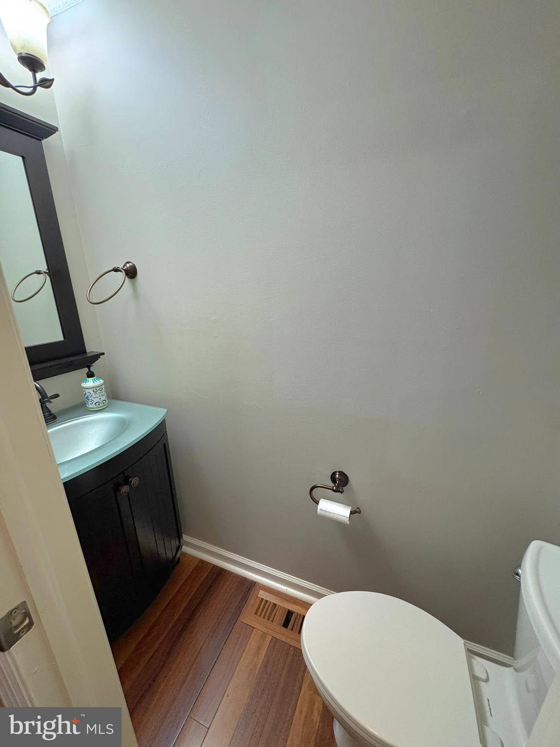 2108 Commodore Court Odenton, MD 21113 - Photo 7 of 38 a bathroom with a toilet a sink and a mirror