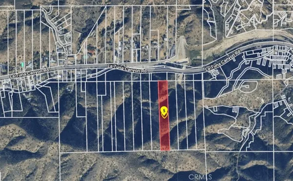 a view of small yard and wooden deck