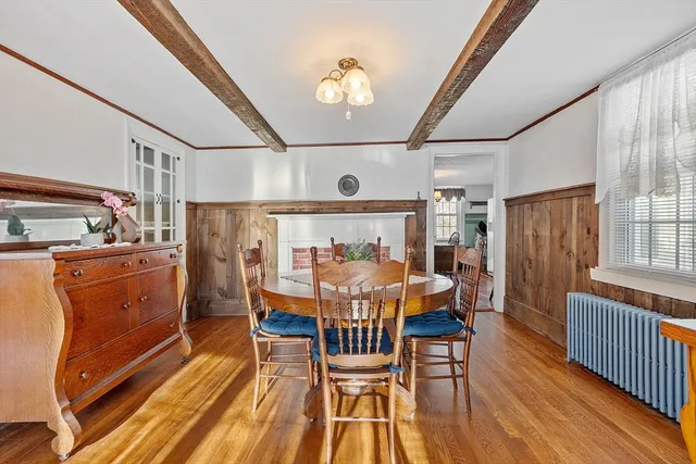a dining room with furniture and wooden floor