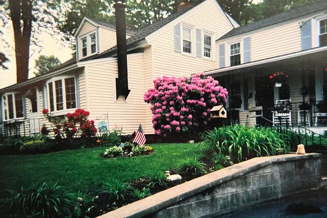 a front view of a house with garden