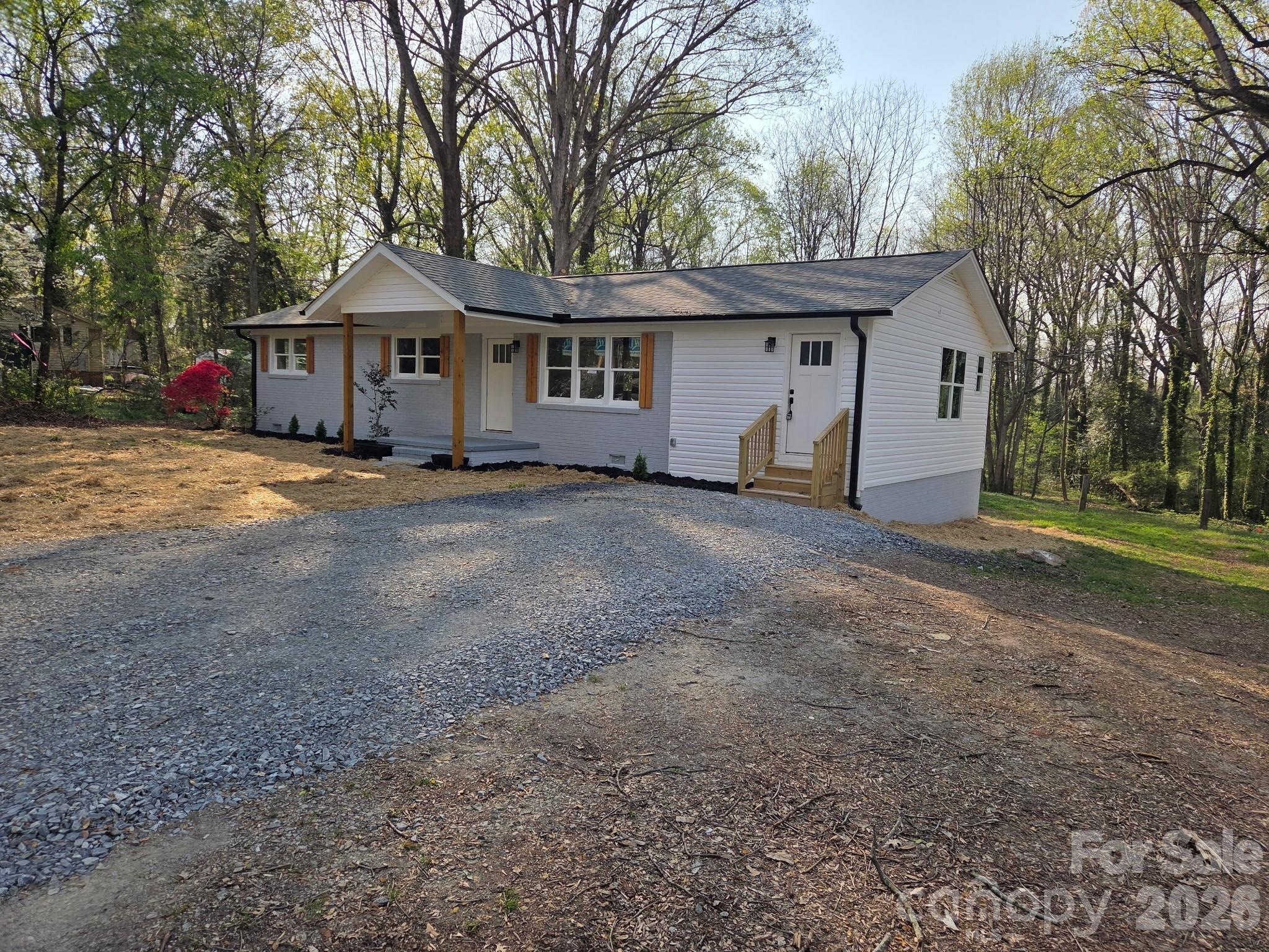 520 Summerow Road Stanley, NC 28164 - Photo 1 of 7 a front view of a house with a garden