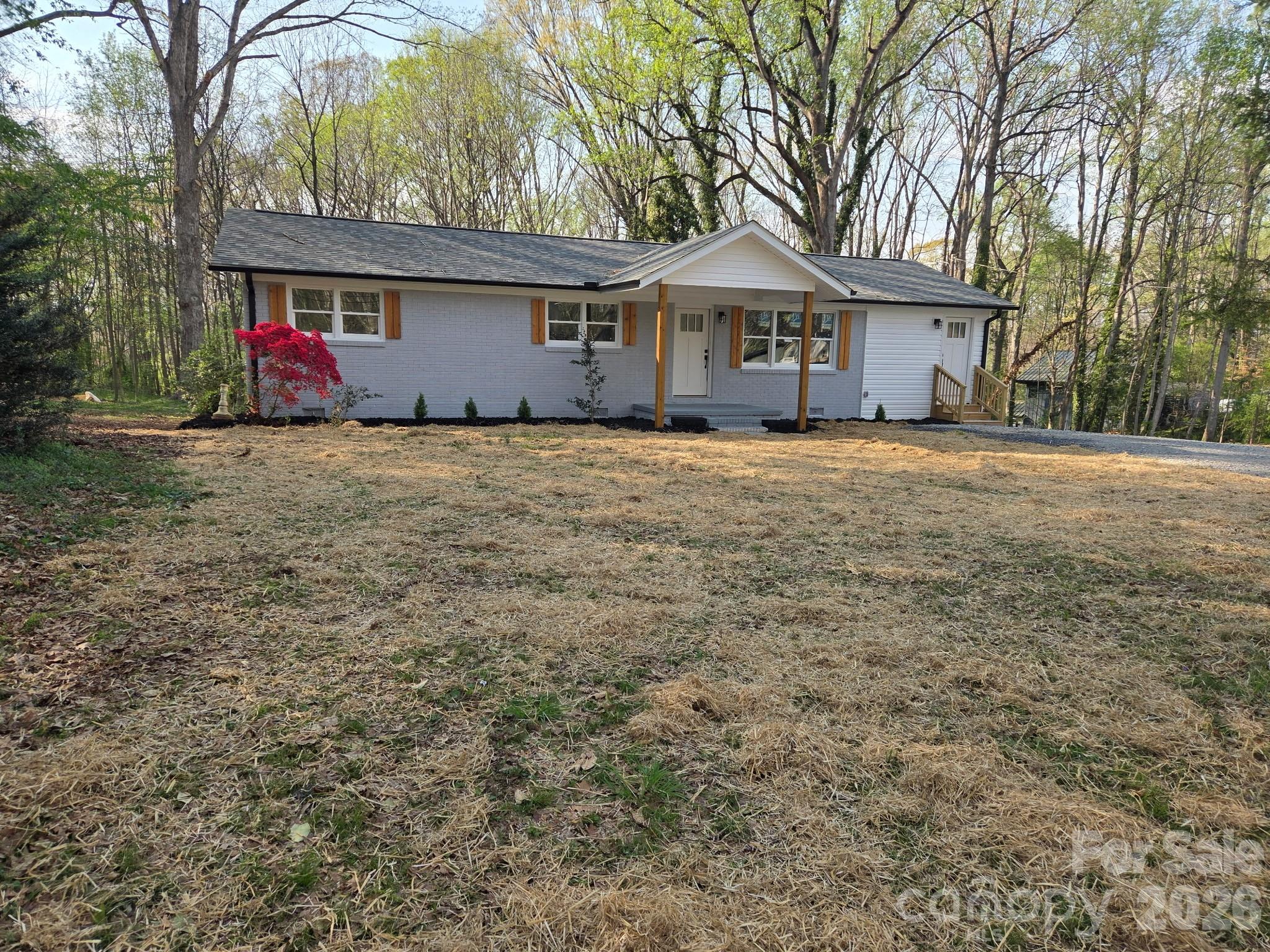 520 Summerow Road Stanley, NC 28164 - Photo 2 of 7 a front view of a house with a garden
