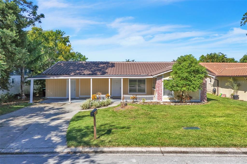 10626 Deergrass Lane Orlando, FL 32821 - Photo 1 of 41 a house view with a sitting space and garden