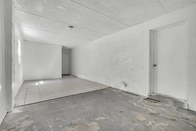 a view of an empty room and window