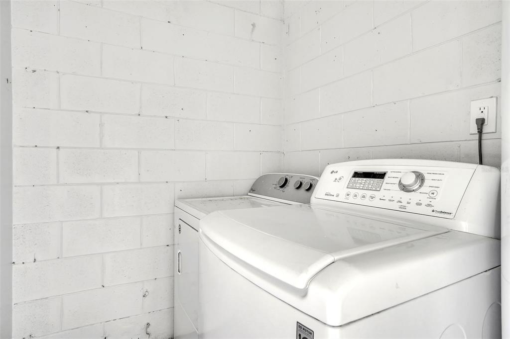 10626 Deergrass Lane Orlando, FL 32821 - Photo 27 of 41 a utility room with washer and dryer