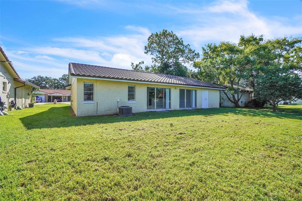 10626 Deergrass Lane Orlando, FL 32821 - Photo 28 of 41 a view of a house with backyard and garden