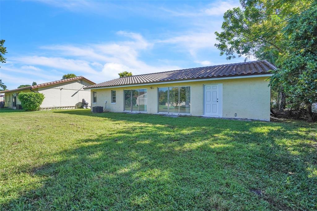 10626 Deergrass Lane Orlando, FL 32821 - Photo 29 of 41 a view of a house with a backyard