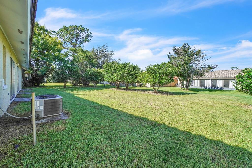 10626 Deergrass Lane Orlando, FL 32821 - Photo 30 of 41 a view of a house with a yard
