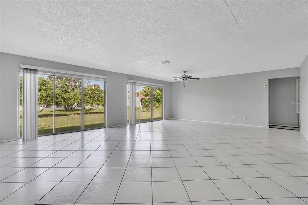 10626 Deergrass Lane Orlando, FL 32821 - Photo 3 of 41 a view of an empty room with a window
