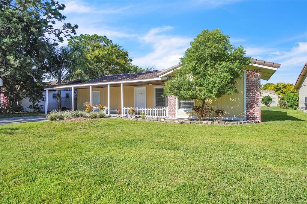 10626 Deergrass Lane Orlando, FL 32821 - Photo 33 of 41 a view of a house with backyard and a tree
