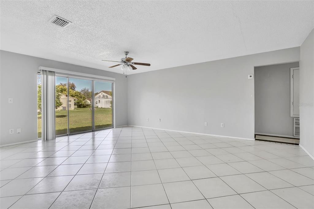 10626 Deergrass Lane Orlando, FL 32821 - Photo 6 of 41 a view of an empty room and window
