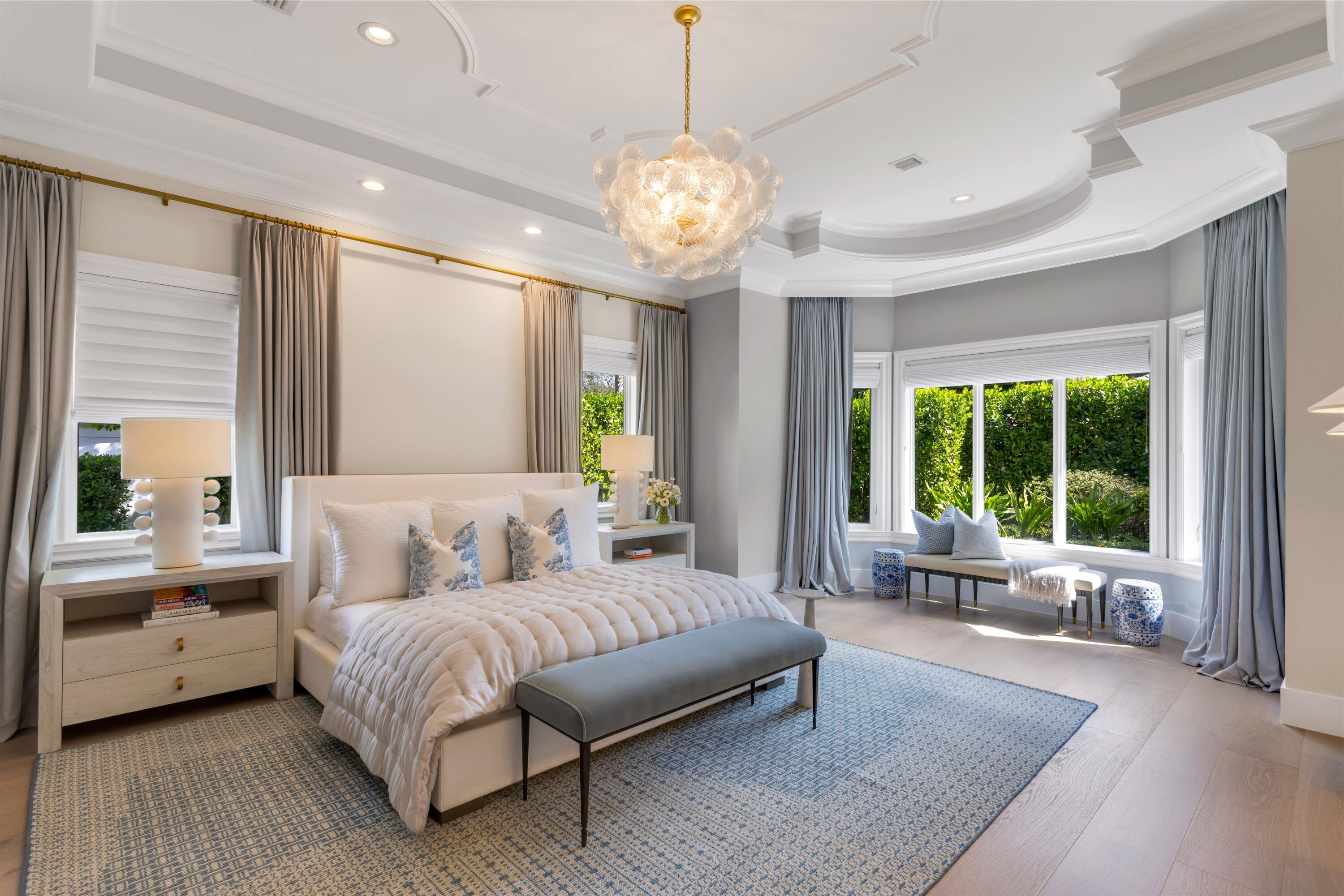 4540 Northwest 24th Avenue Boca Raton, FL 33431 - Photo 17 of 36 a spacious bedroom with a bed and a large window