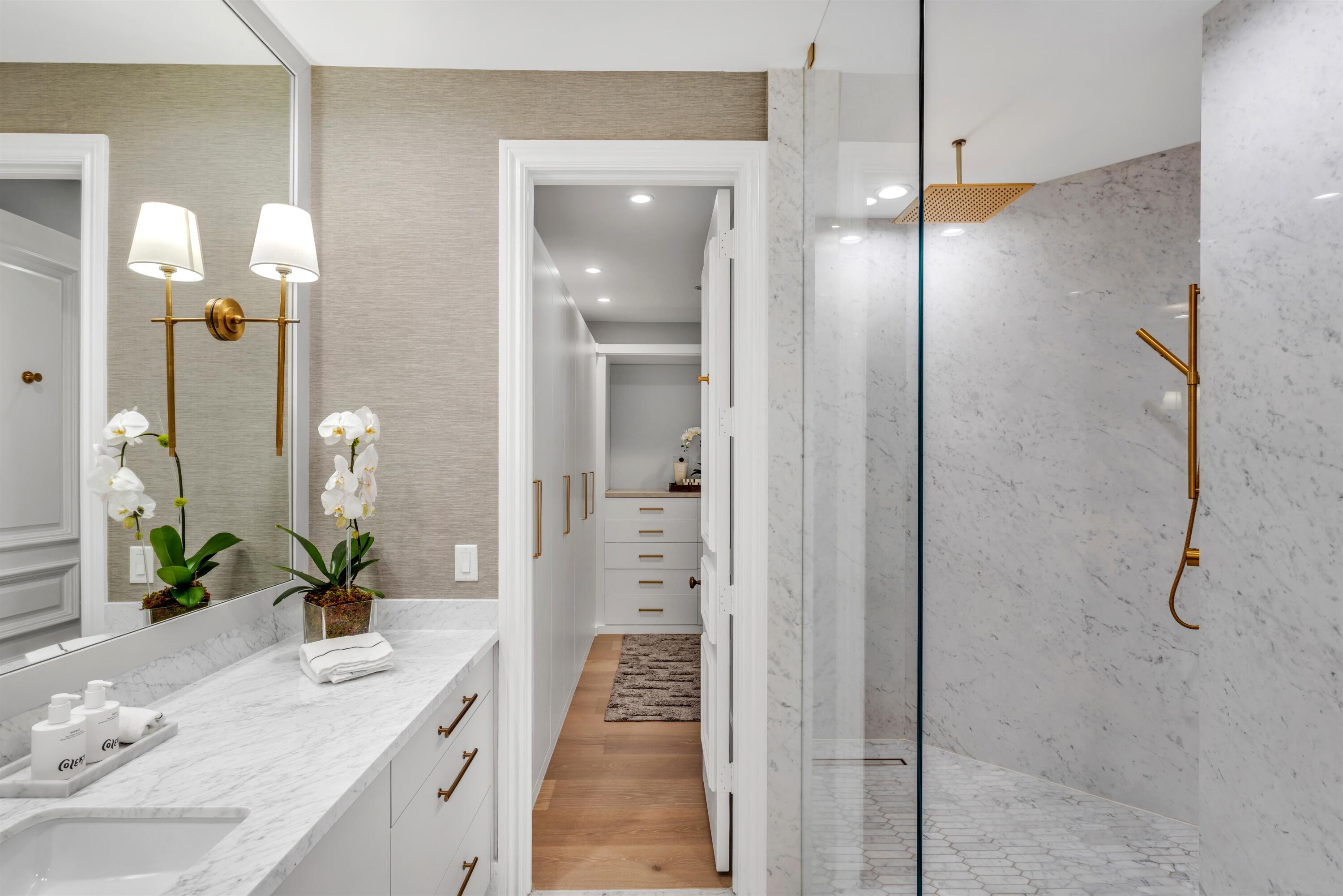 4540 Northwest 24th Avenue Boca Raton, FL 33431 - Photo 23 of 36 a bathroom with a shower sink and mirror