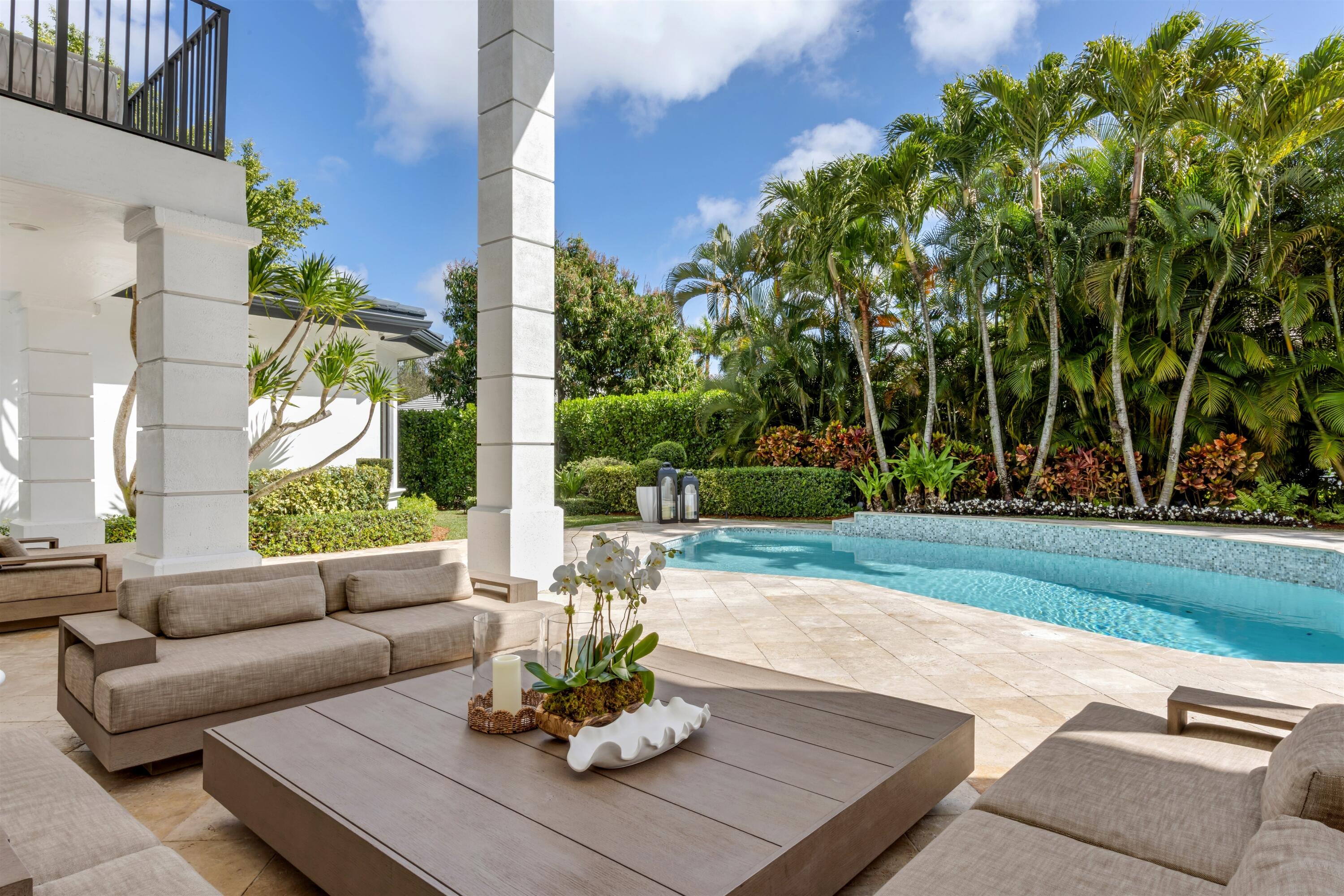 4540 Northwest 24th Avenue Boca Raton, FL 33431 - Photo 27 of 36 a view of a patio with couches chairs and a big yard
