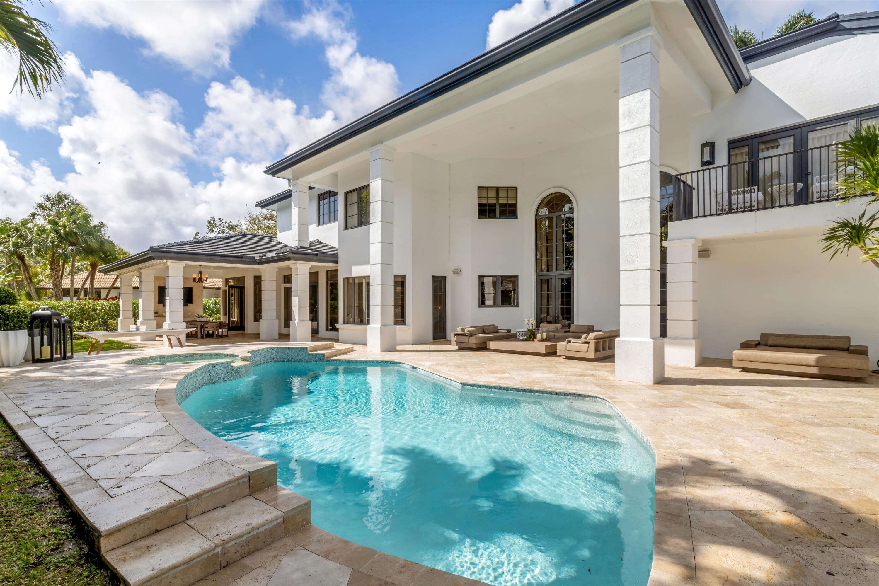 4540 Northwest 24th Avenue Boca Raton, FL 33431 - Photo 28 of 36 a view of a house with swimming pool and sitting area