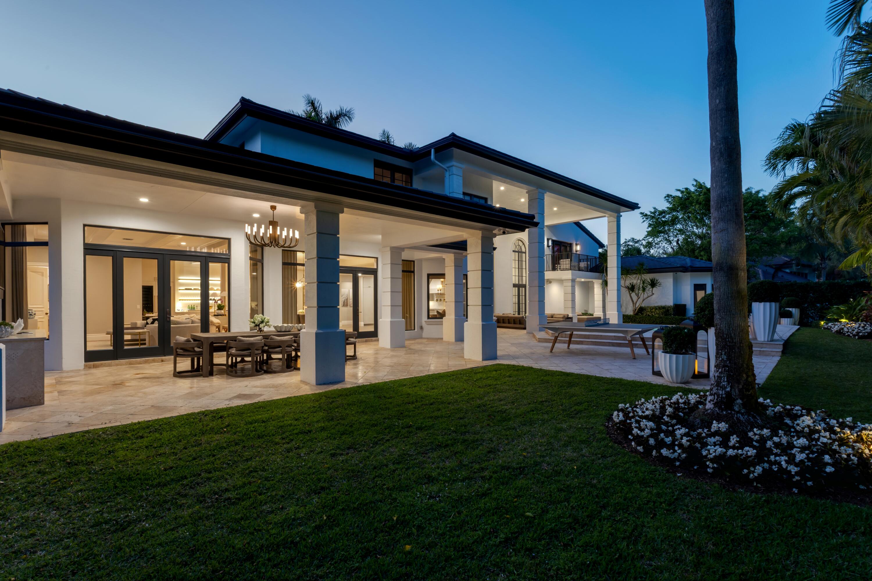 4540 Northwest 24th Avenue Boca Raton, FL 33431 - Photo 32 of 36 a view of a house with a porch and a garden