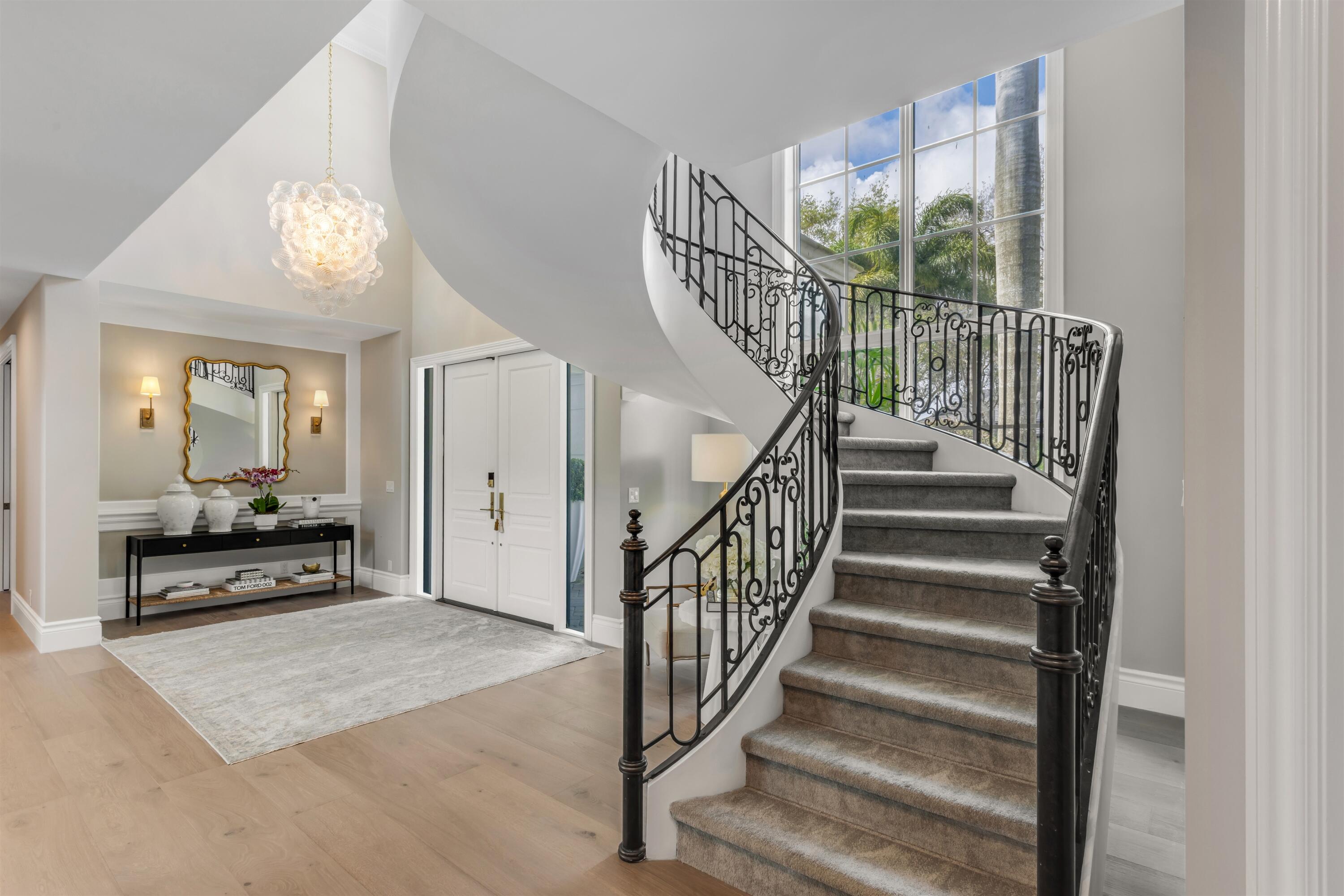 4540 Northwest 24th Avenue Boca Raton, FL 33431 - Photo 5 of 36 a view of entryway livingroom and hall with wooden floor