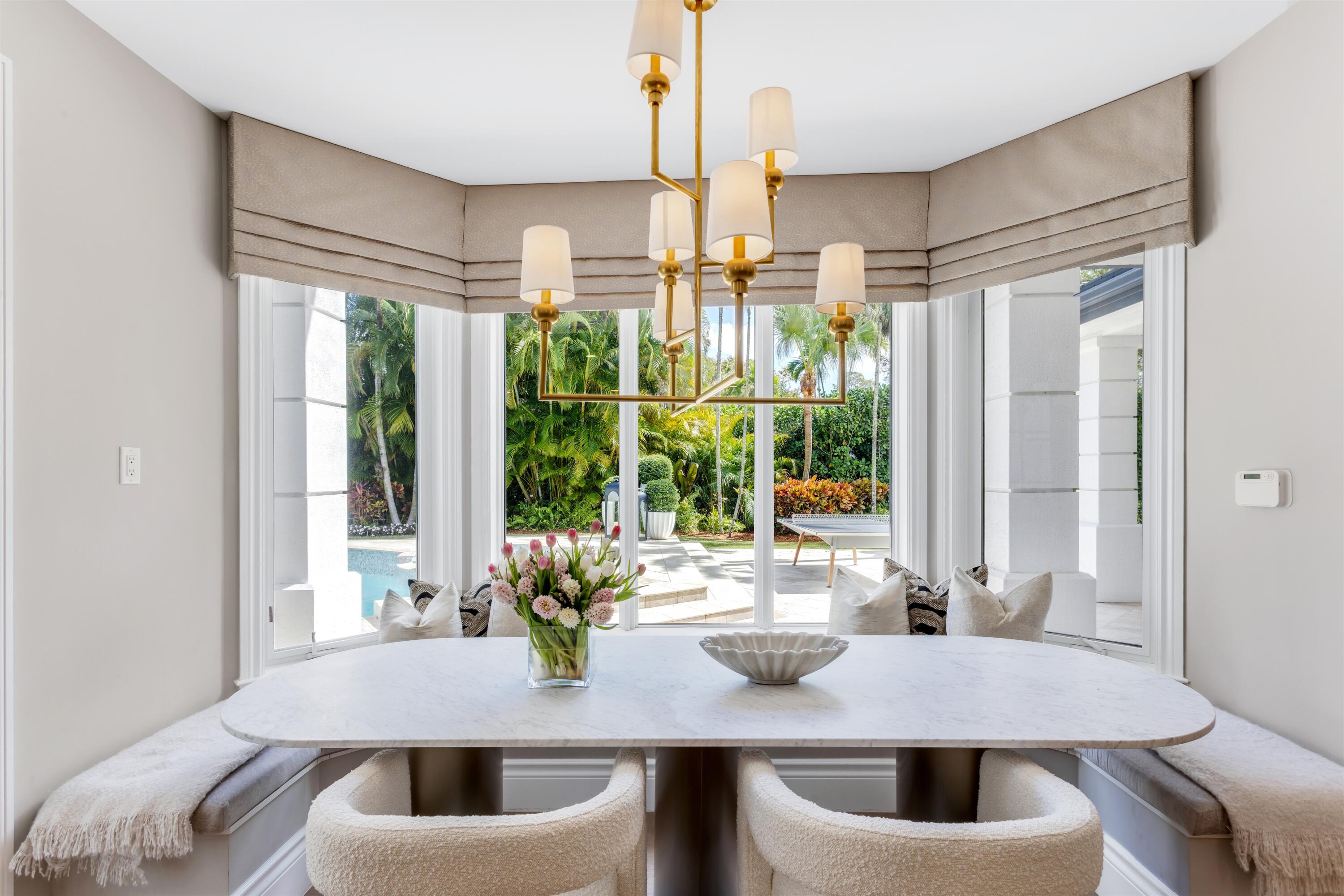 4540 Northwest 24th Avenue Boca Raton, FL 33431 - Photo 9 of 36 a view of kitchen and dining area with furniture