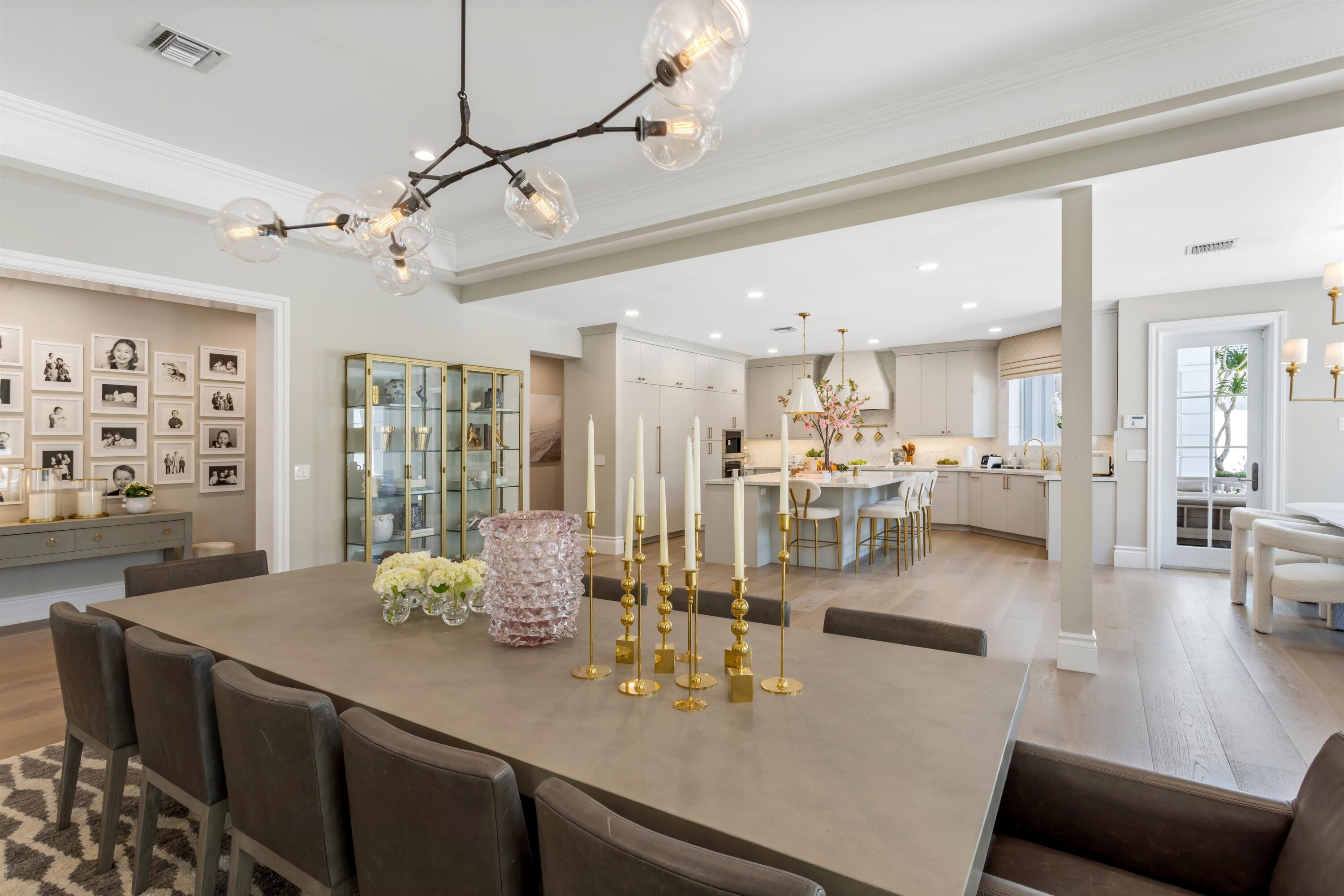4540 Northwest 24th Avenue Boca Raton, FL 33431 - Photo 10 of 36 a view of a dining room and livingroom with furniture wooden floor a chandelier