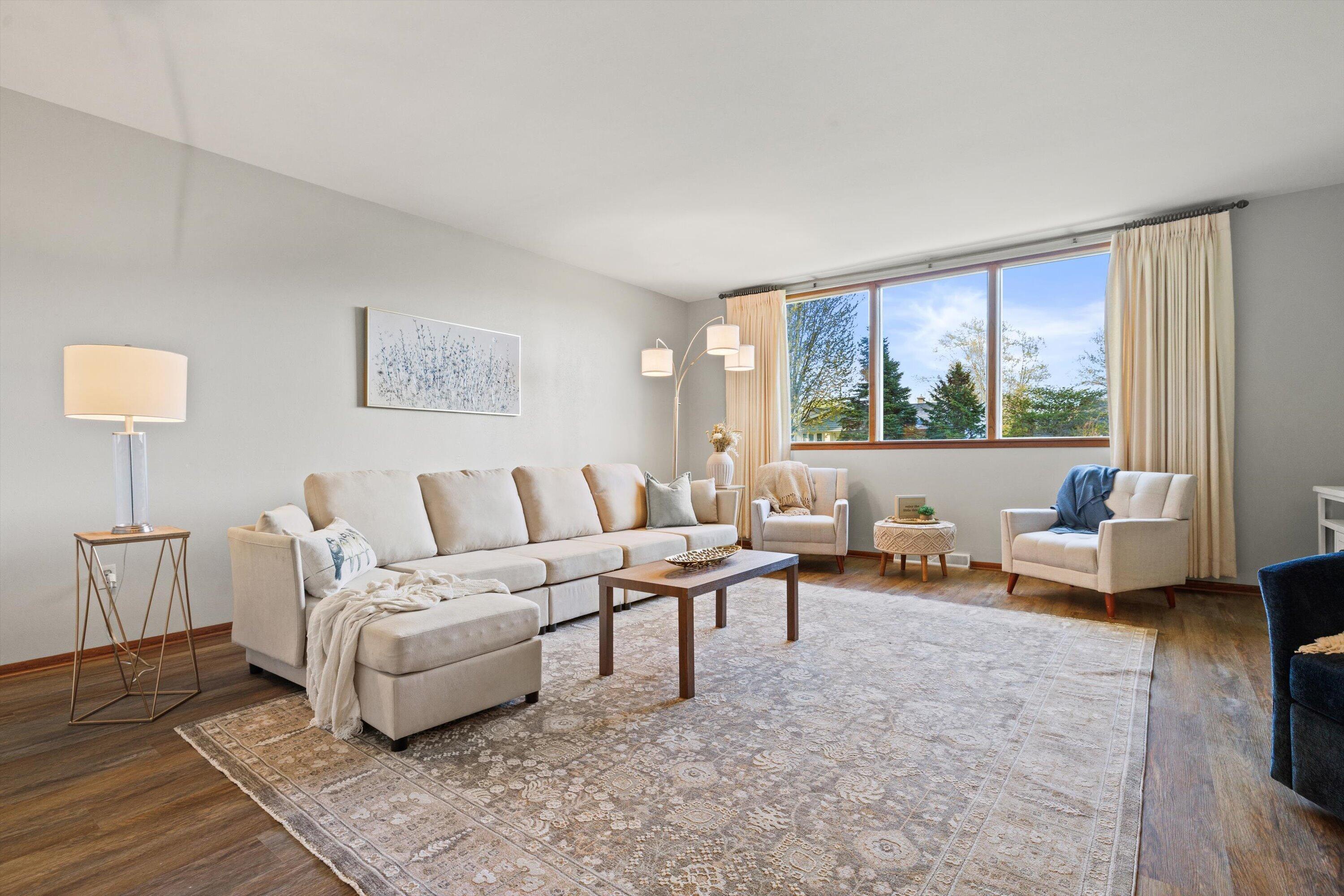 726 Royal Park Road Caledonia, WI 53402 - Photo 19 of 29 Sunlight pours through the large picture window, filling this spacious living room with warmth and natural light