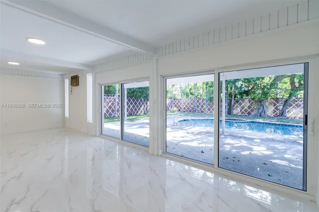a bathroom with a sink toilet a mirror and shower