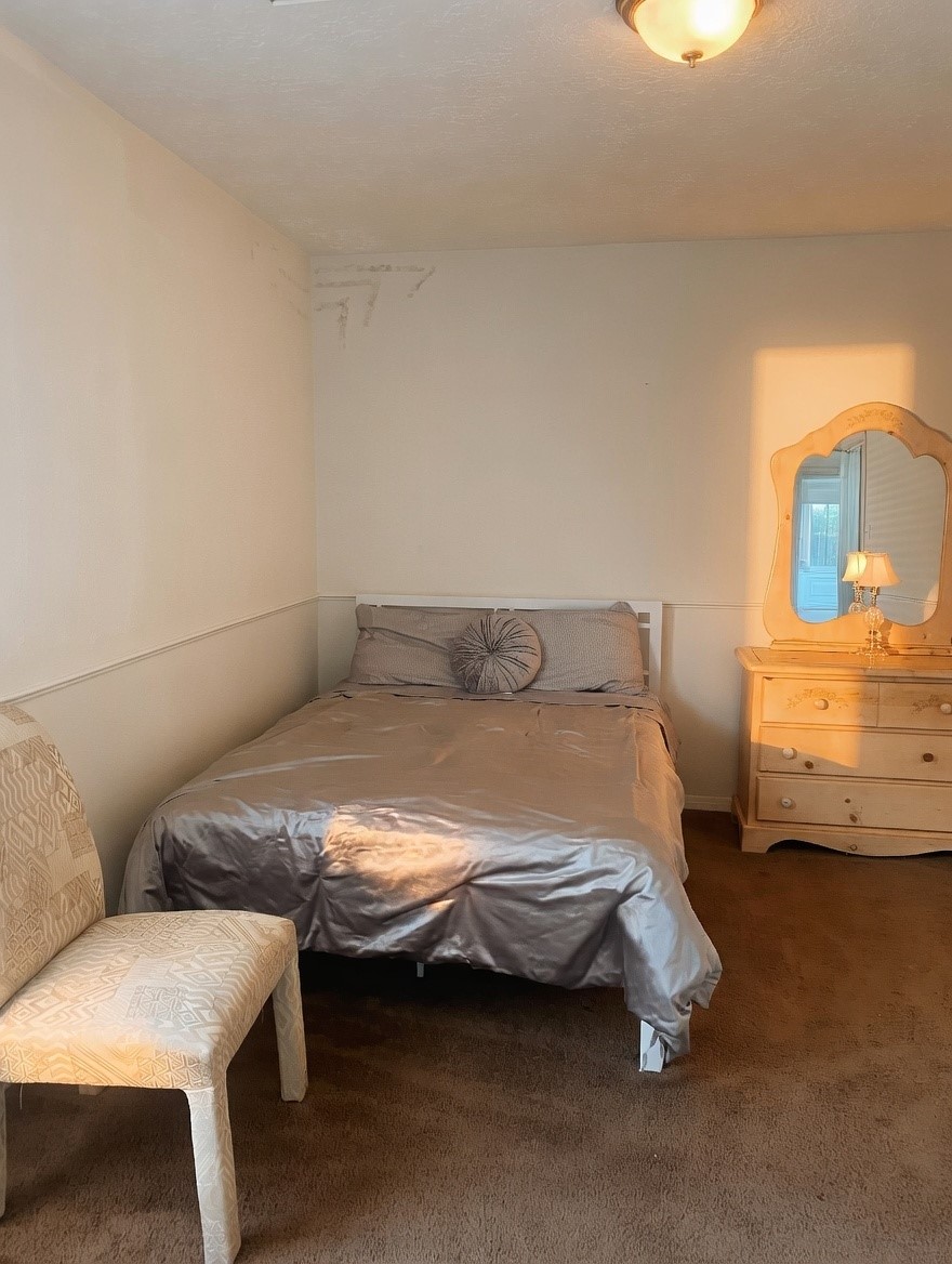 15922 Cutten Road Houston, TX 77070 - Photo 12 of 22 a bedroom with bed and window